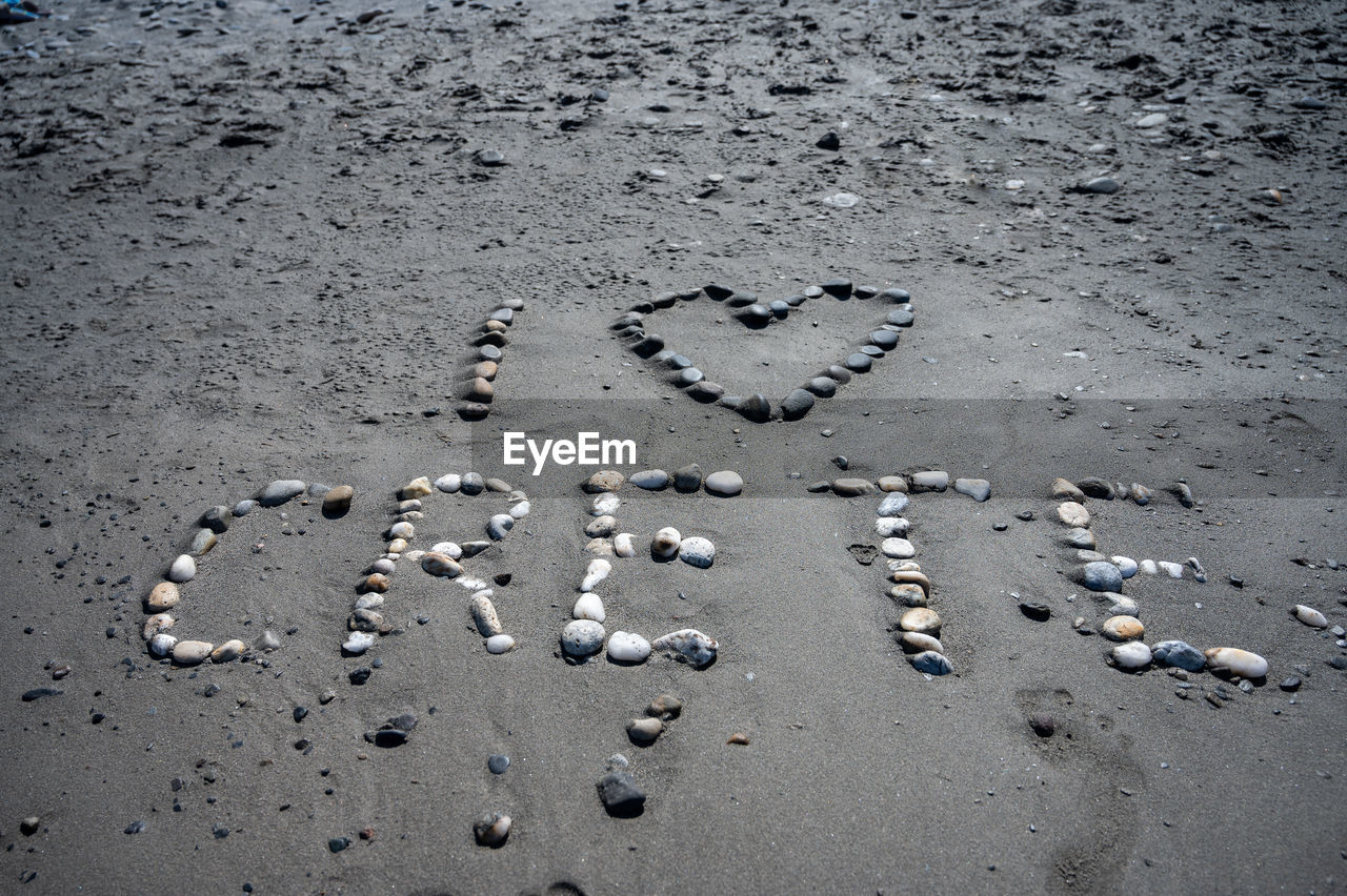 high angle view of footprints on sand