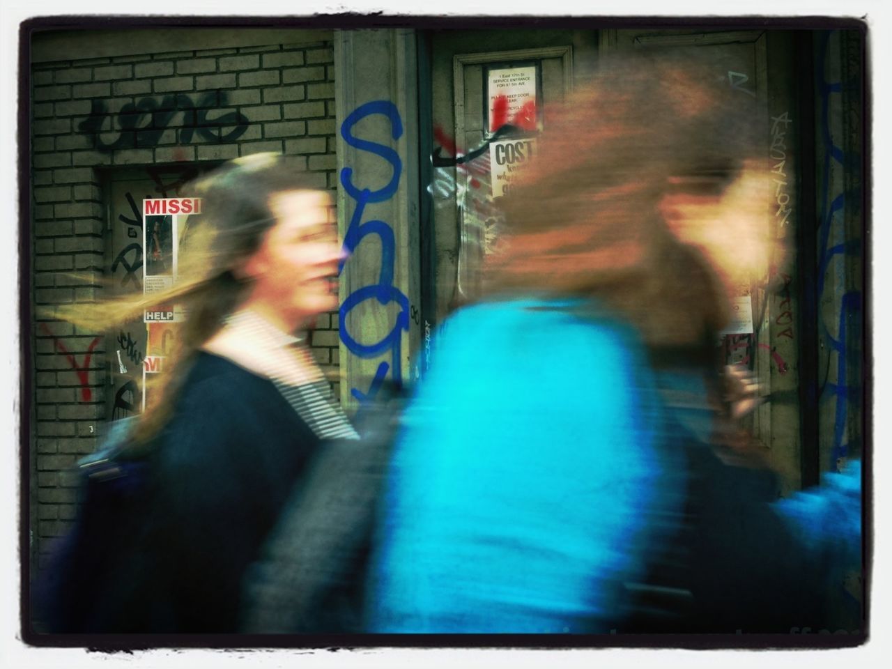 BLURRED MOTION OF WOMAN IN RAIN