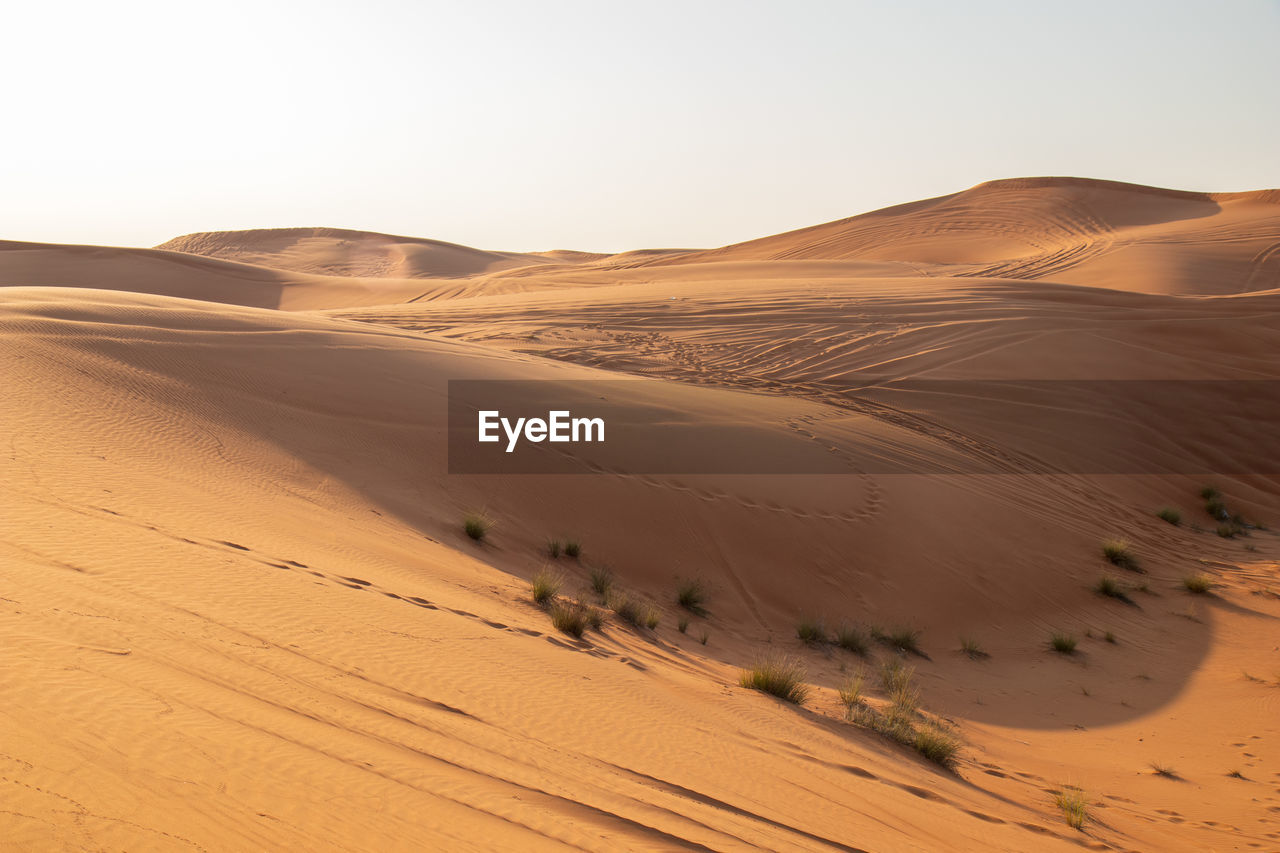 Scenic view of desert against clear sky