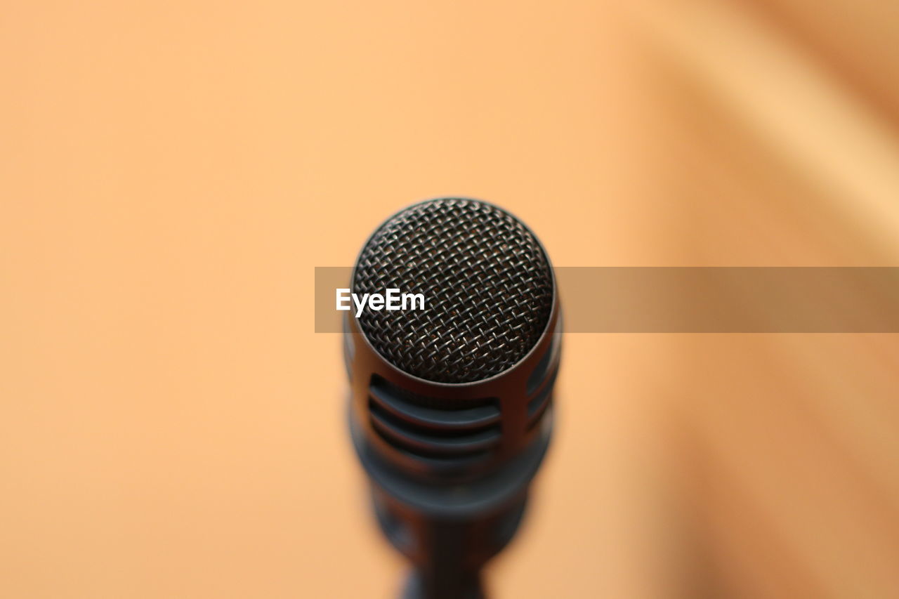 CLOSE-UP OF ELECTRIC FAN ON WALL