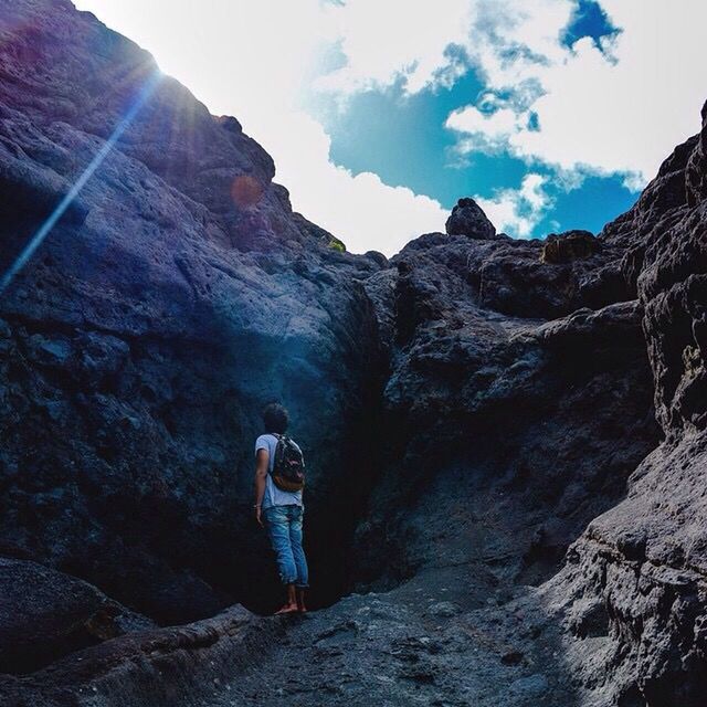 PEOPLE HIKING ON ROCKY MOUNTAIN