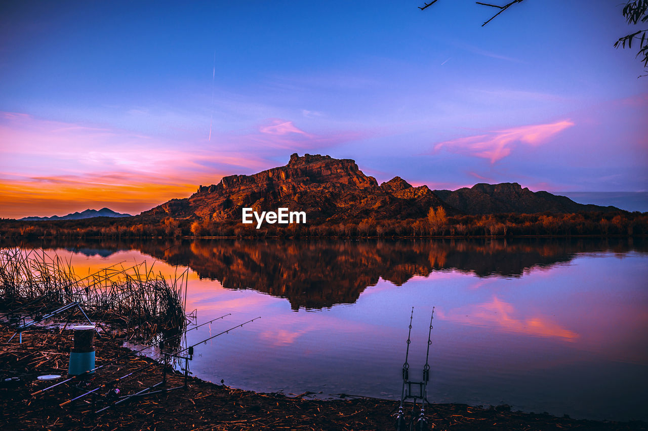 Scenic view of lake against sky during sunset