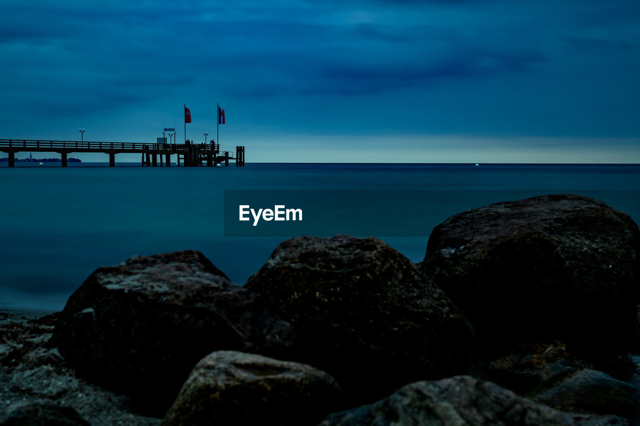 Rocks as breakwaters on the baltic sea beach