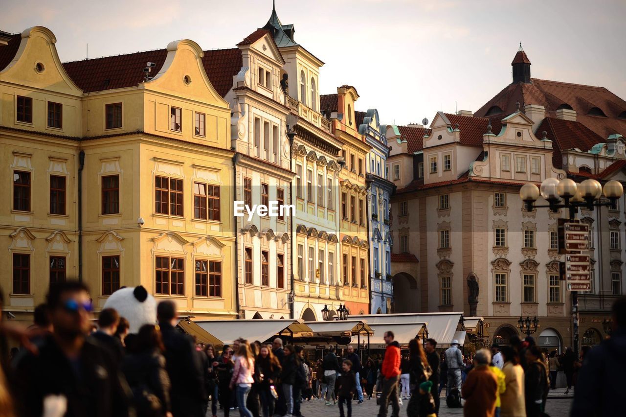 Group of people in front of buildings in city