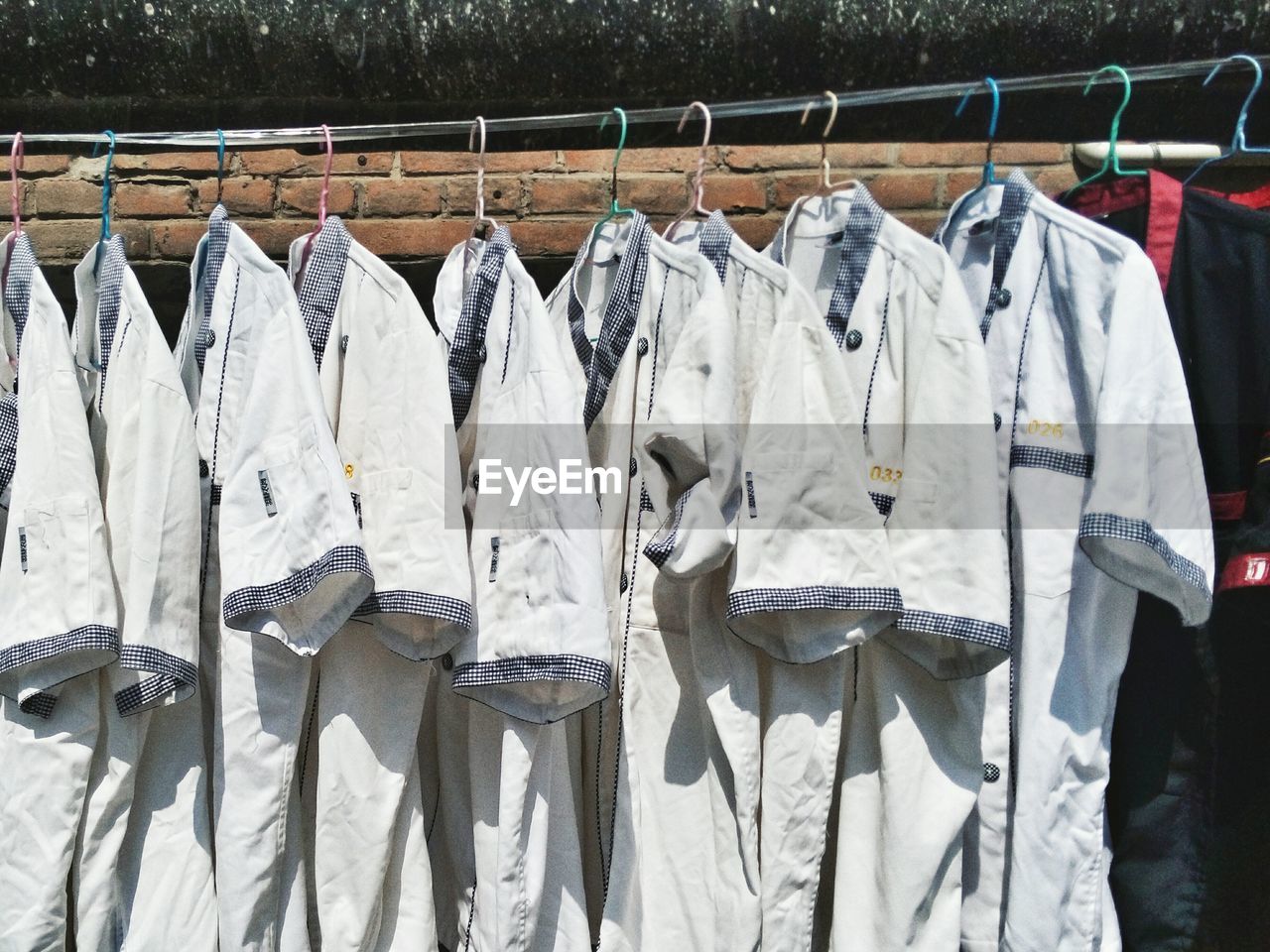 CLOTHES DRYING AGAINST WHITE BACKGROUND