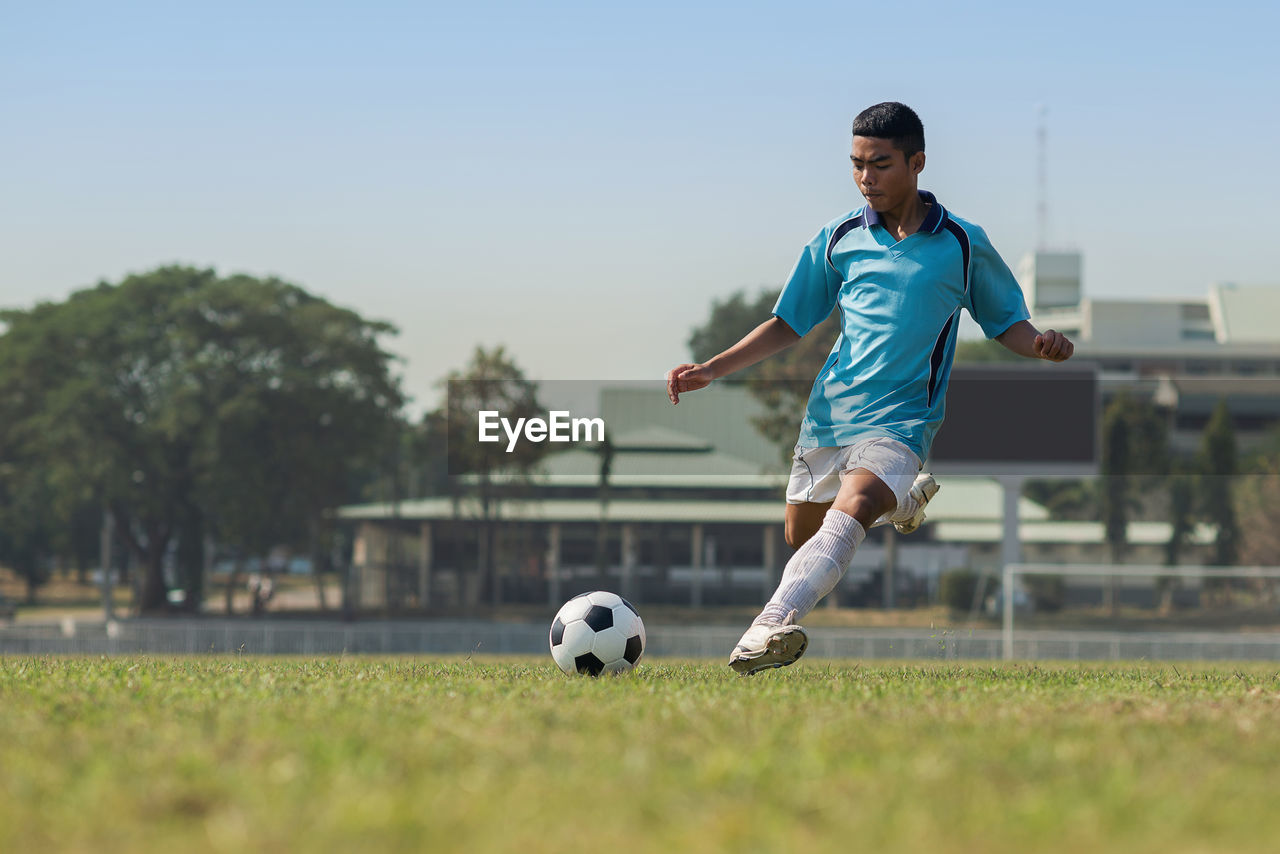 Man playing soccer on field