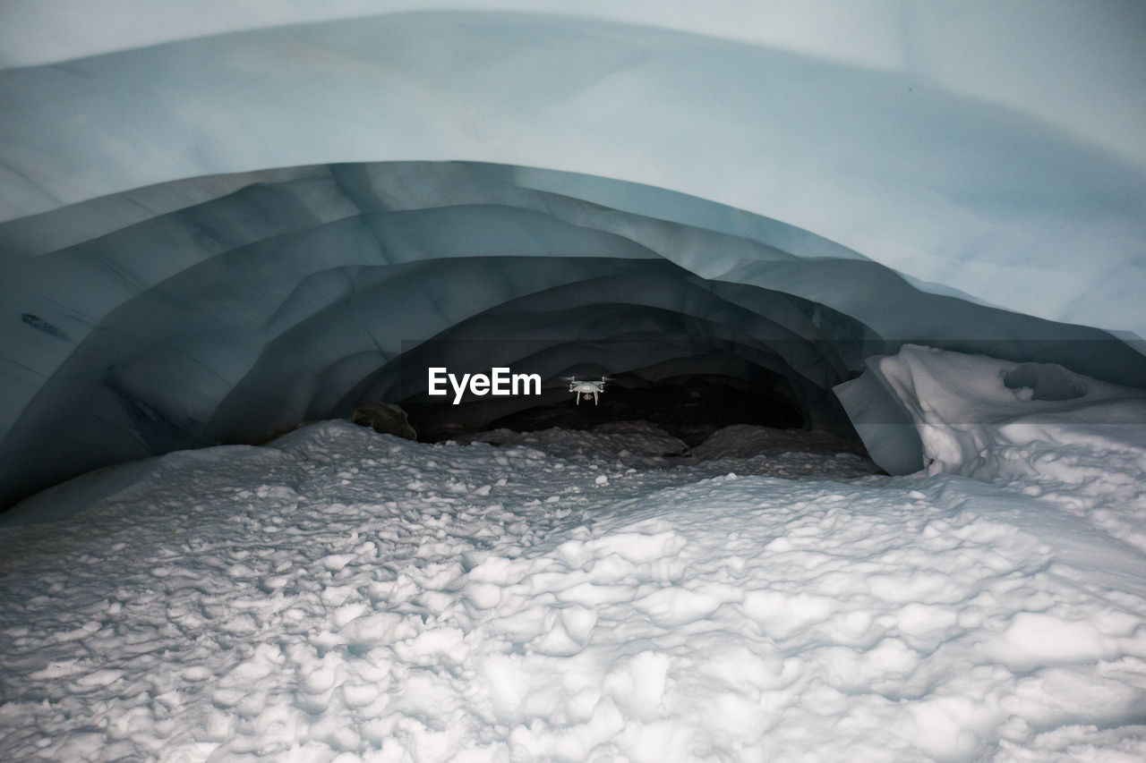 Drone flies deep into glacier cave to document climate change. precision