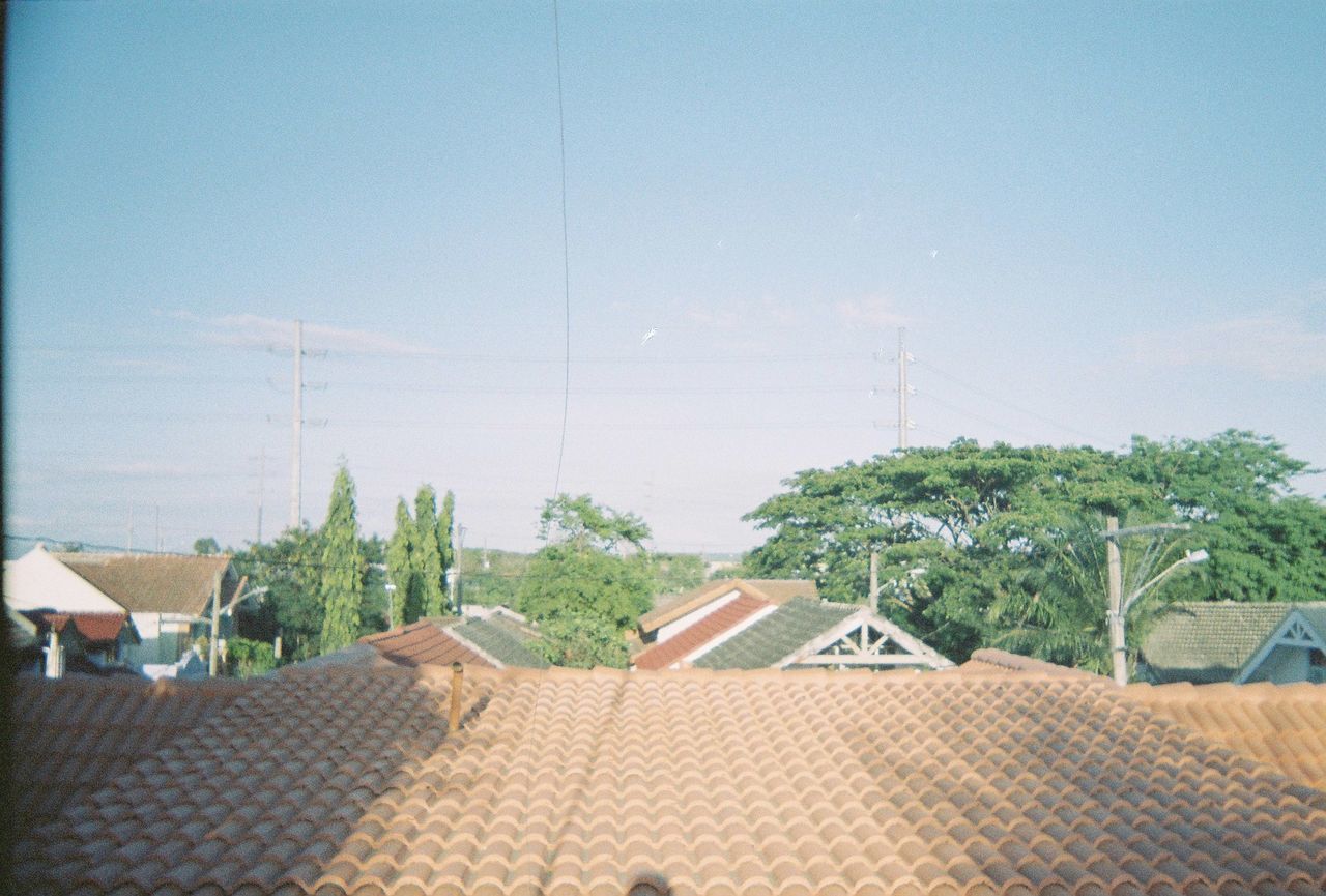 PANORAMIC VIEW OF RESIDENTIAL DISTRICT AGAINST CLEAR SKY