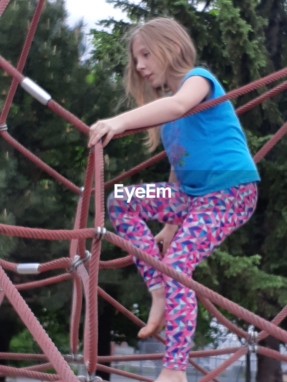 GIRL PLAYING ON PLAYGROUND