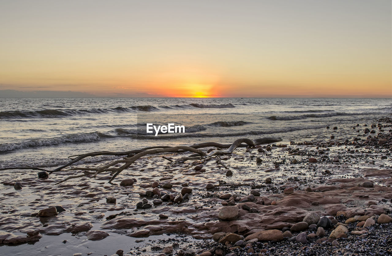 Scenic view of beach during sunset