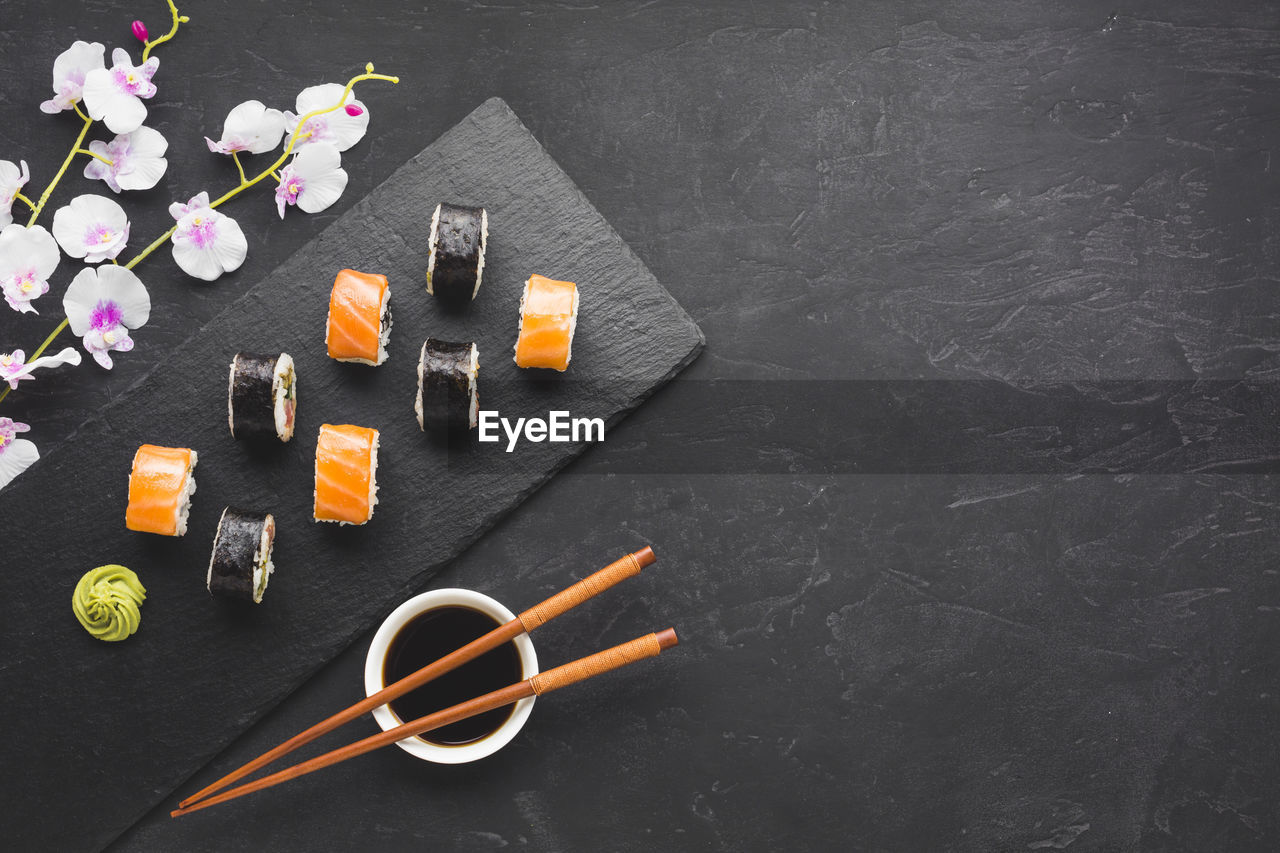 flower, flowering plant, no people, art, blackboard, yellow, freshness, indoors, high angle view, plant, food and drink, still life, copy space, directly above, food, studio shot, board, table, creativity, wood, knolling - concept, gray