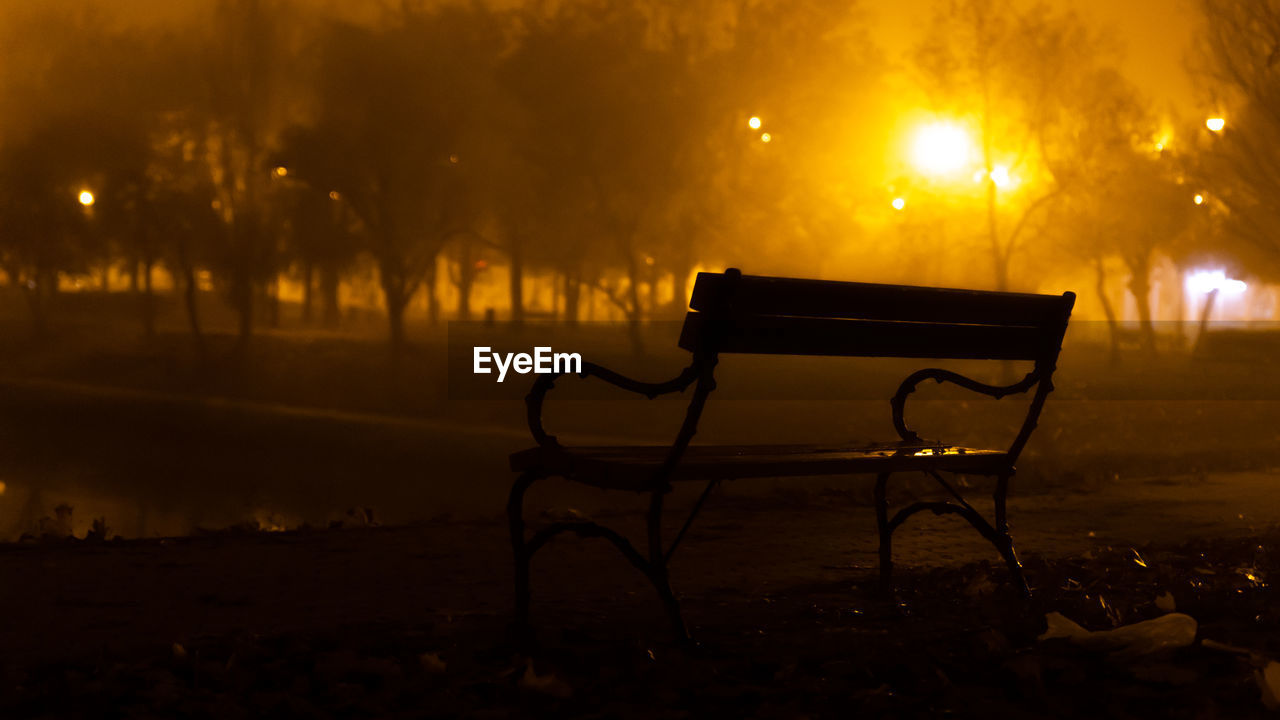 morning, night, seat, light, darkness, fog, bench, nature, tree, absence, no people, tranquility, illuminated, chair, park, plant, sky, park bench, outdoors, silhouette, park - man made space, land, beauty in nature, empty, tranquil scene