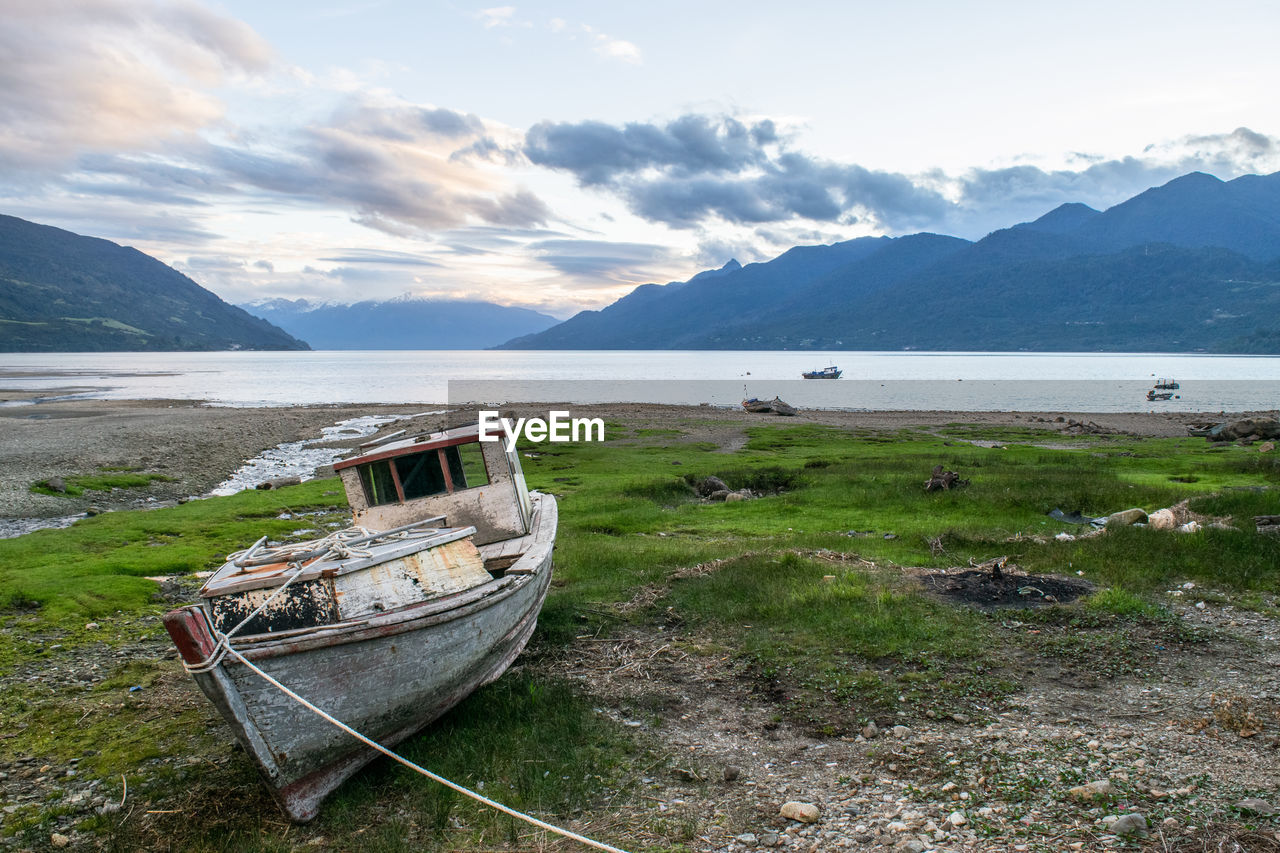 boat moored in sea against sky