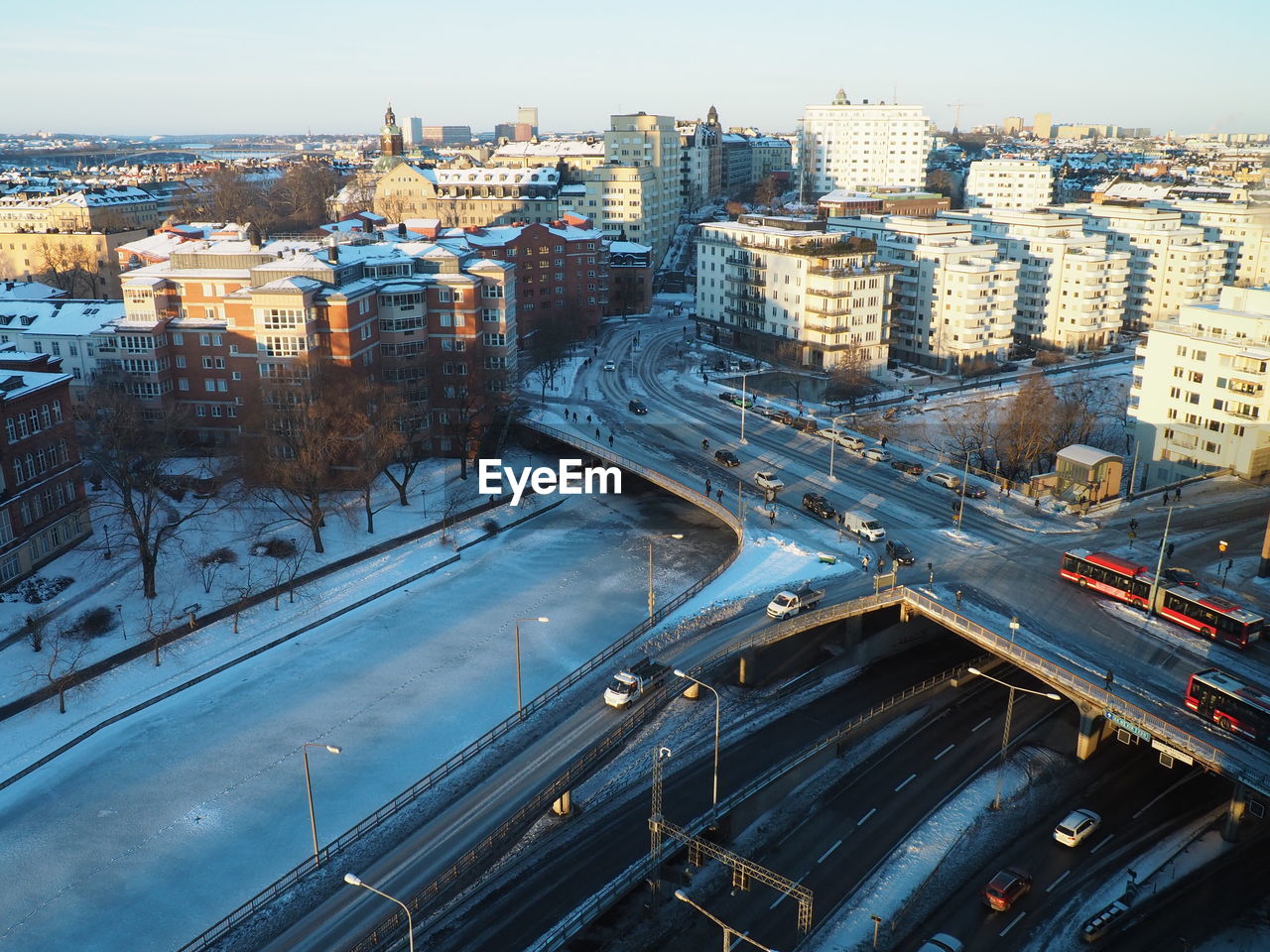 High angle view of city street and buildings against sky