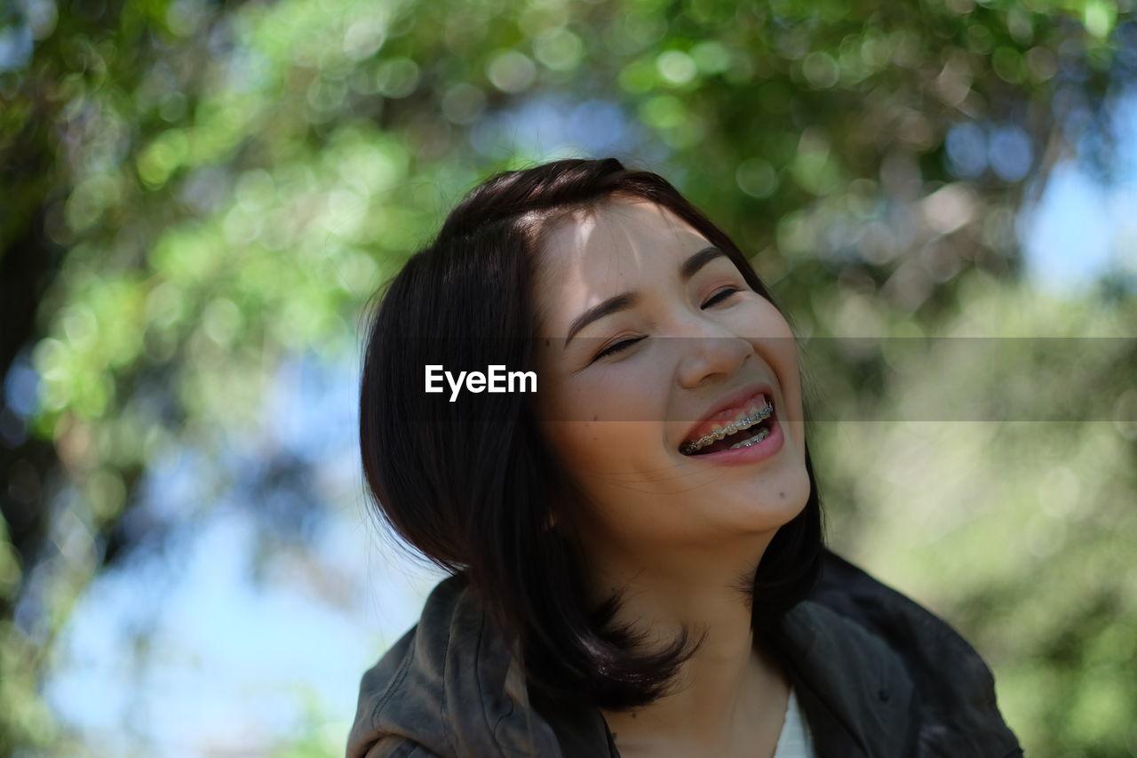 Young smiling woman wearing braces