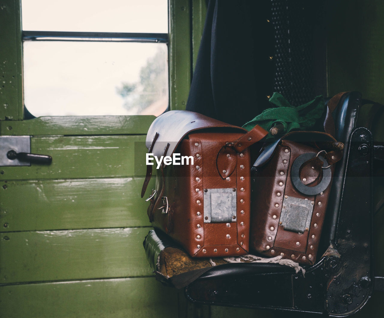 Close-up of leather bags in train