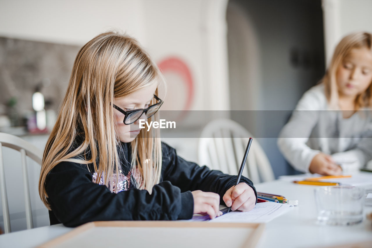 Girl at home doing homework