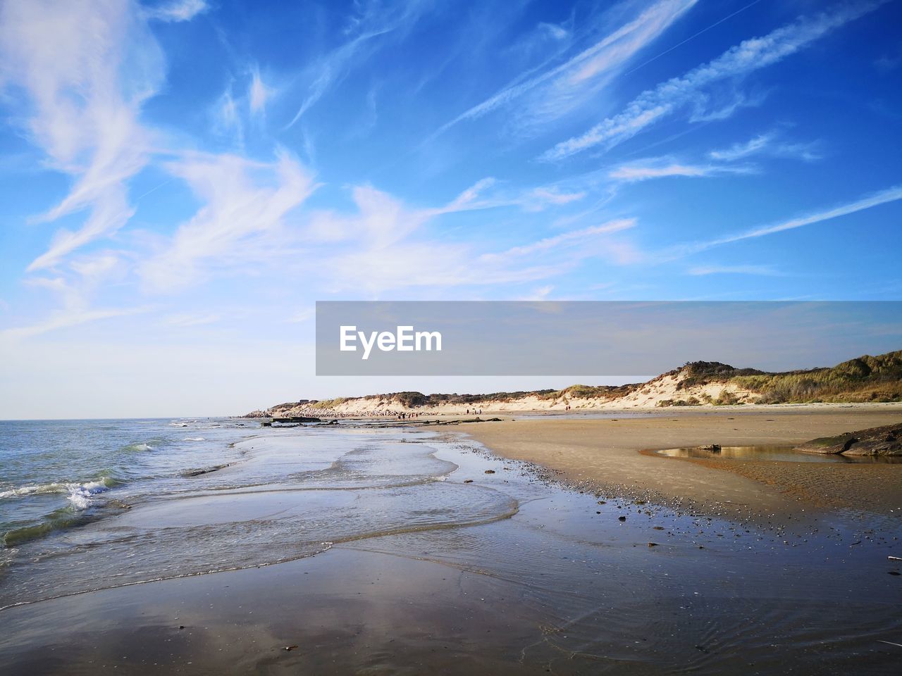 Scenic view of beach against sky