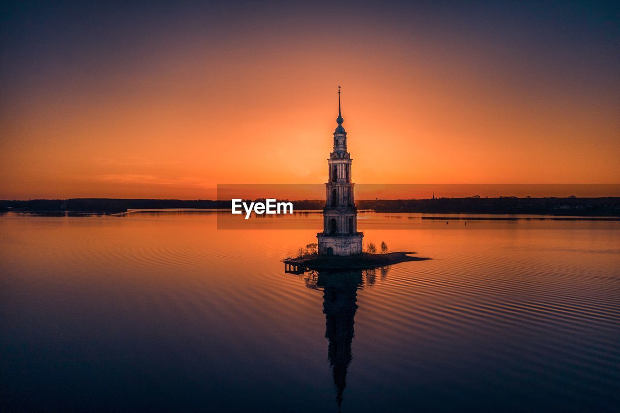 Sunrise on the river. church in sunrise 