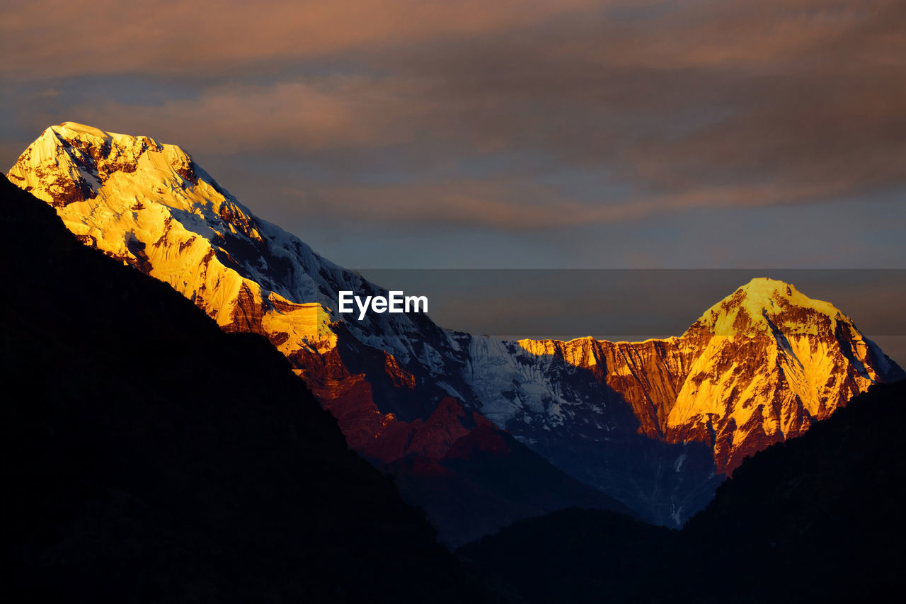 Scenic view of mountain against sky during sunset