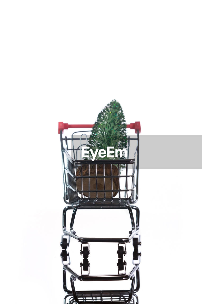 CLOSE-UP OF BASKET ON WHITE BACKGROUND