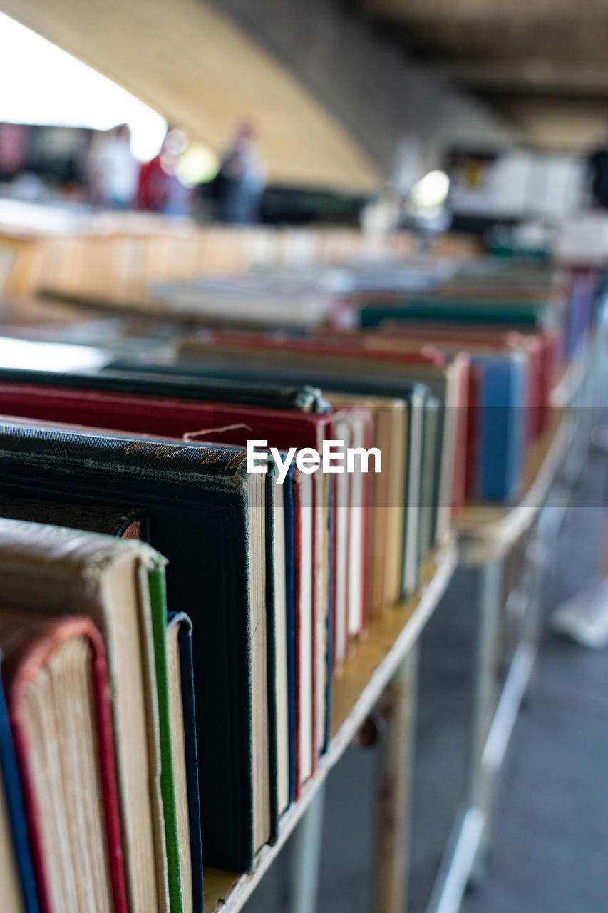 CLOSE-UP OF BOOKS IN ROW