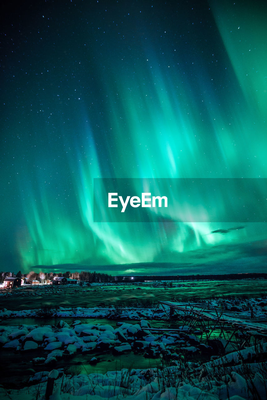 Scenic view of river against sky at night