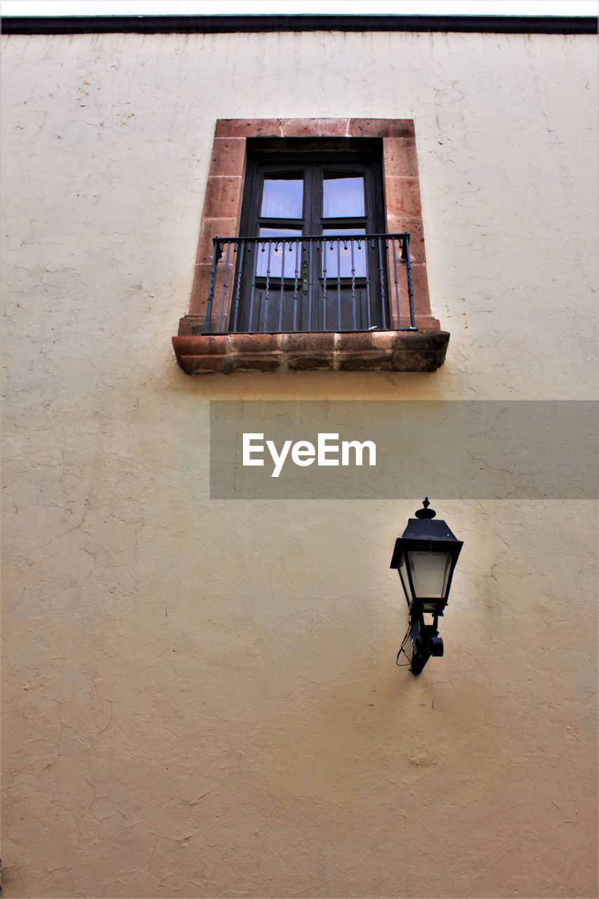 LOW ANGLE VIEW OF ELECTRIC LAMP ON BUILDING