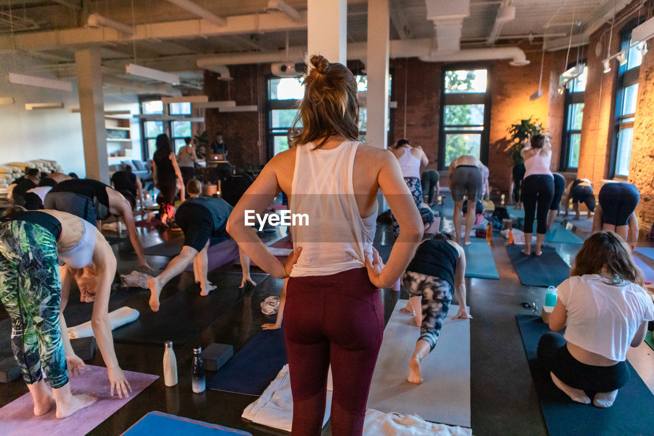 Rear view of people walking in corridor