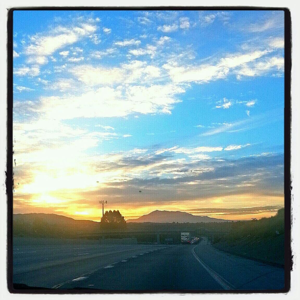 VIEW OF ROAD AT SUNSET