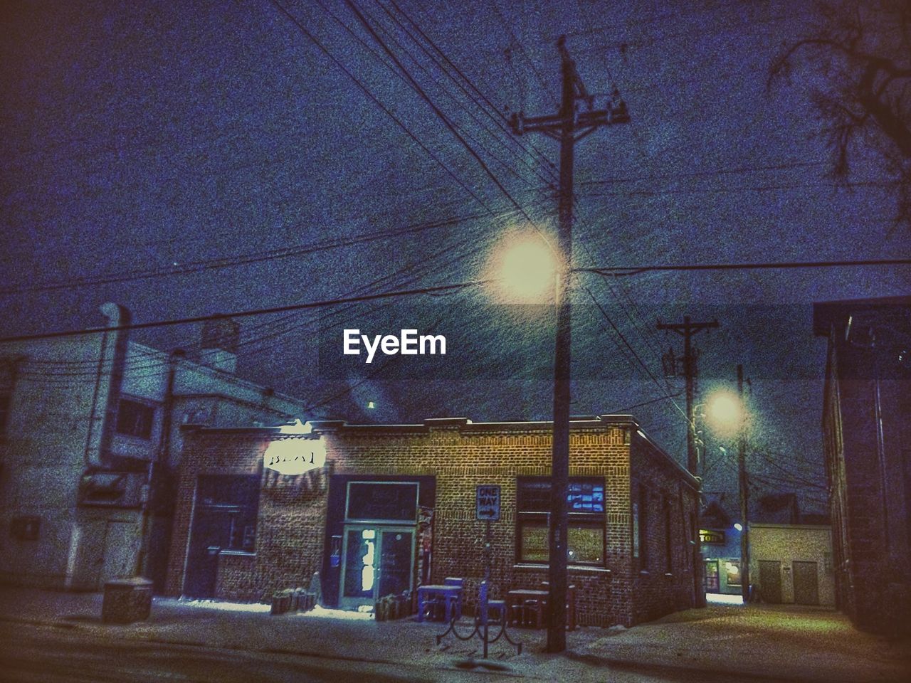 VIEW OF ILLUMINATED BUILDINGS AGAINST SKY