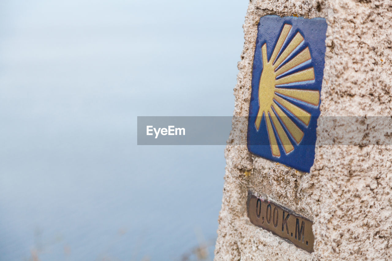 CLOSE-UP OF FLAG ON BEACH