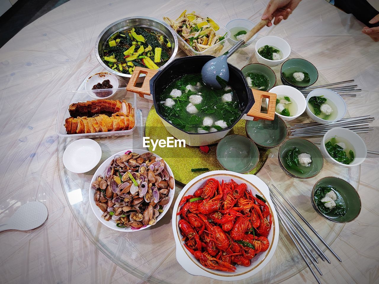 food and drink, food, table, healthy eating, high angle view, wellbeing, freshness, dish, meal, vegetable, bowl, plate, hand, cuisine, indoors, asian food, supper, variation, lifestyles, salad, lunch, fruit, meat, directly above