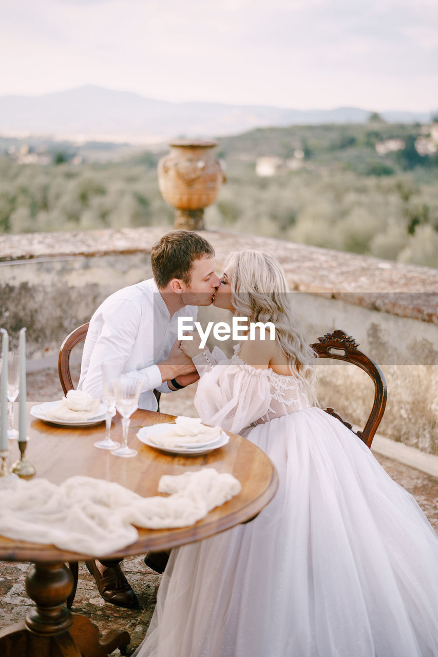 Rear view of couple on glass