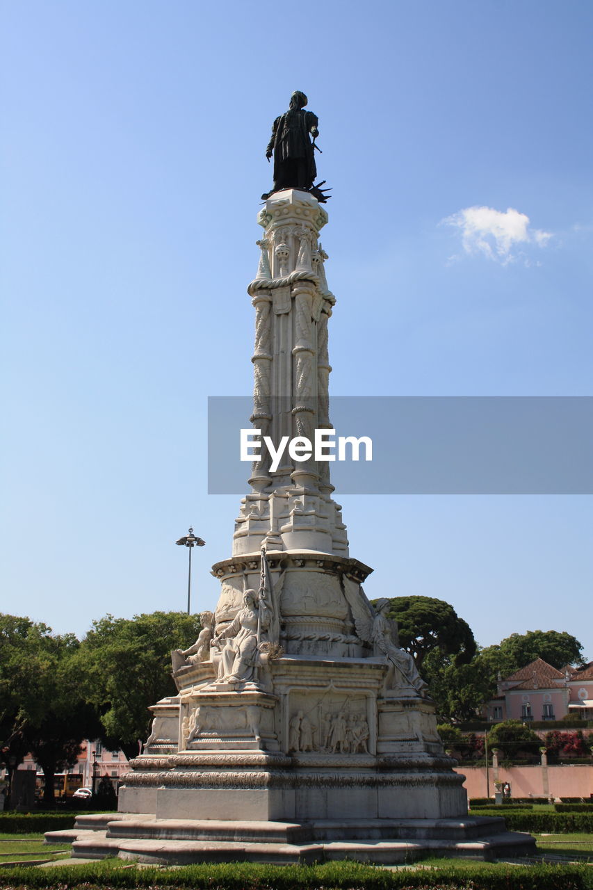 Low angle view of statue against the sky