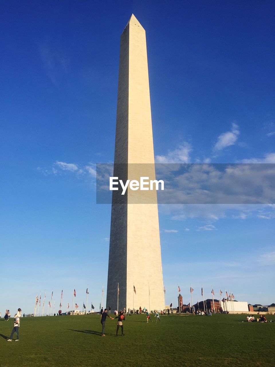 LOW ANGLE VIEW OF PEOPLE AT PARK