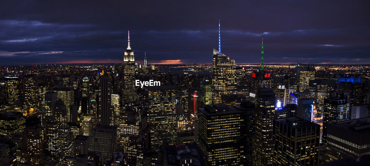 Illuminated buildings in city at night