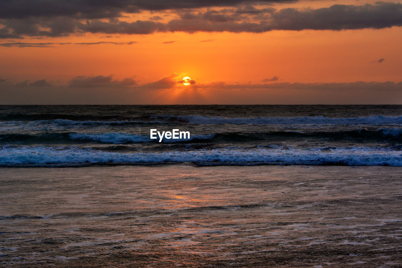 Scenic view of sea during sunset