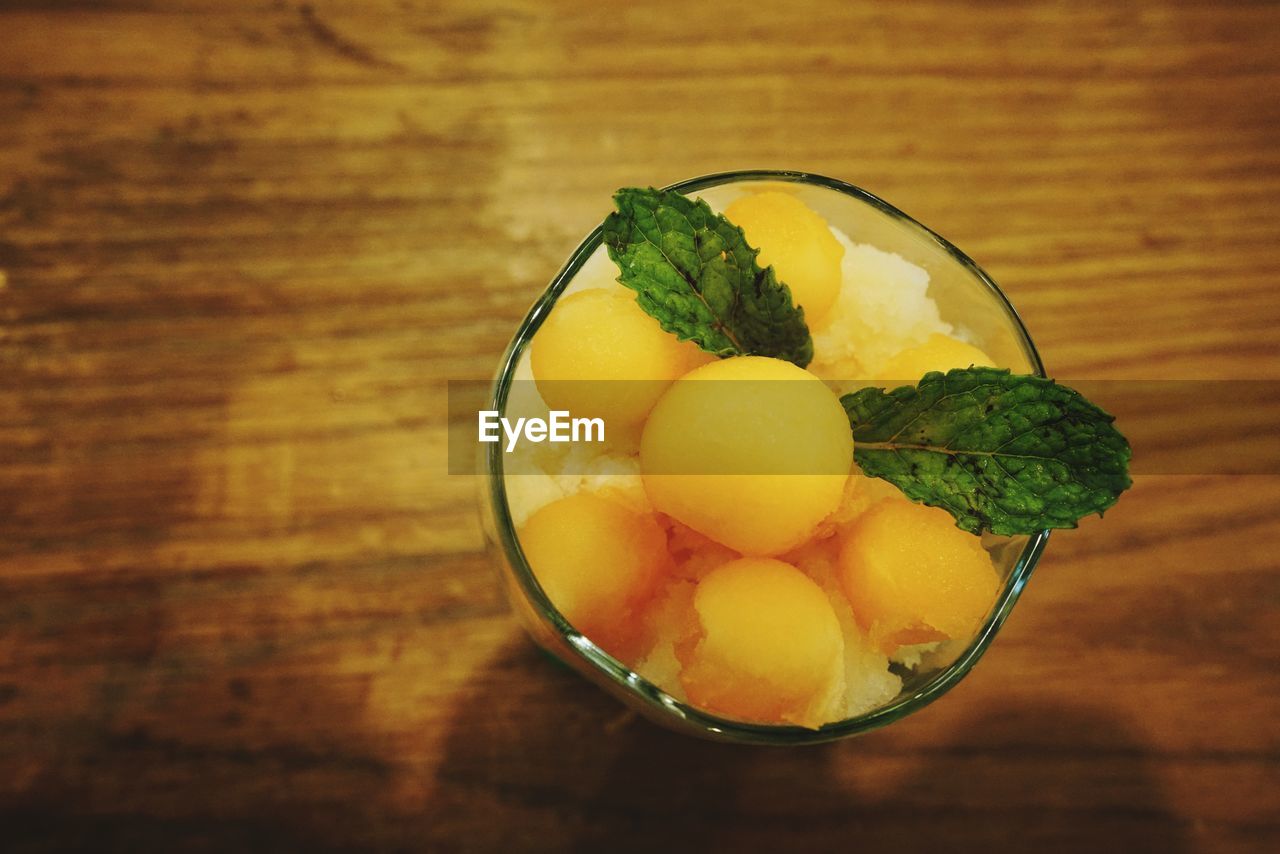 CLOSE-UP OF FRUITS ON TABLE