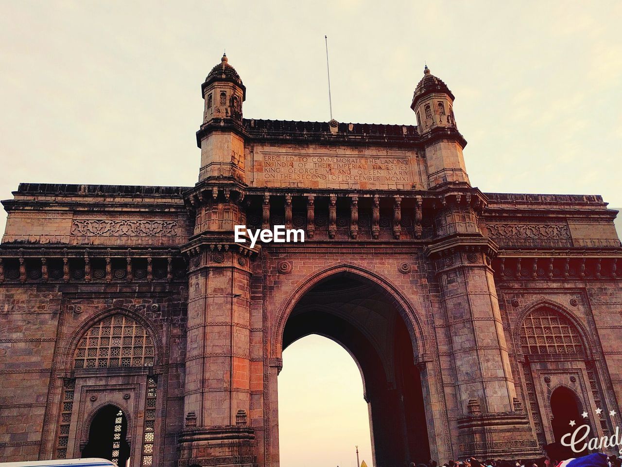 Low angle view of gateway to india against sky in city