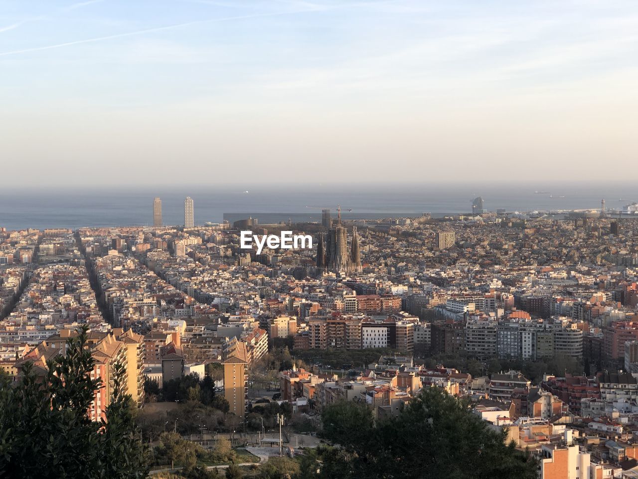 HIGH ANGLE VIEW OF BUILDINGS AND CITY AGAINST SKY