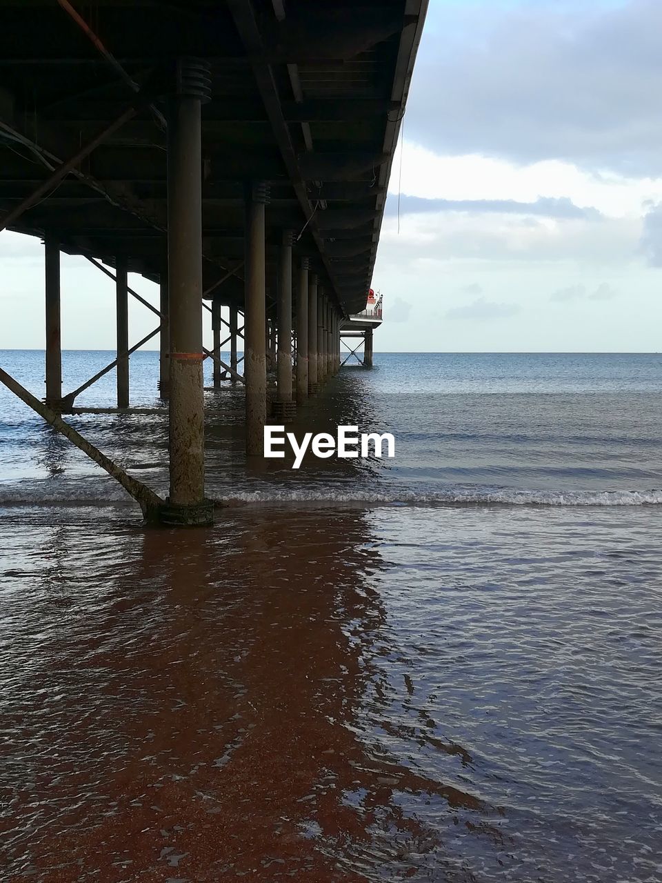 PIER AT SEA AGAINST SKY