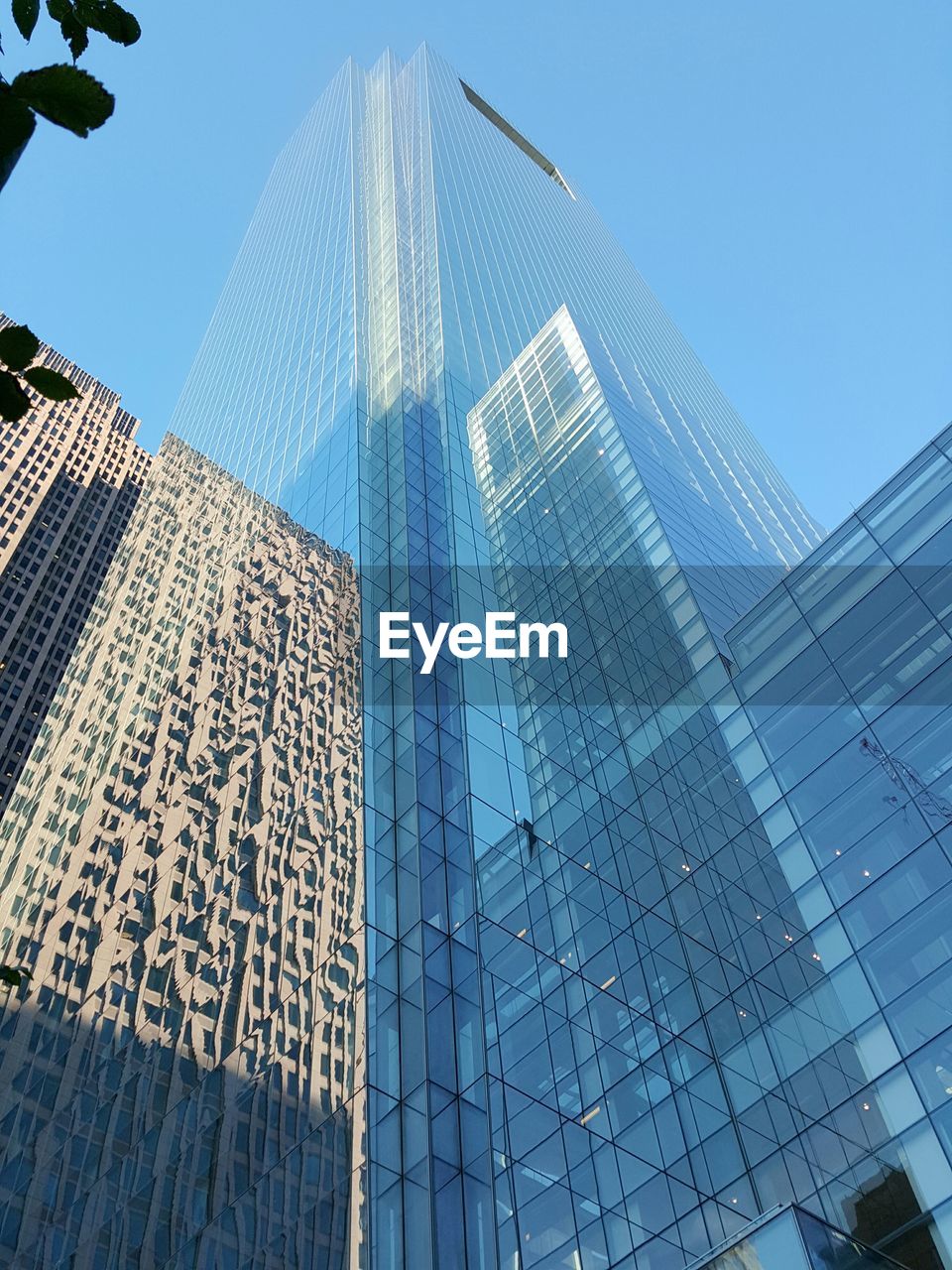 Exterior of modern buildings against clear blue sky