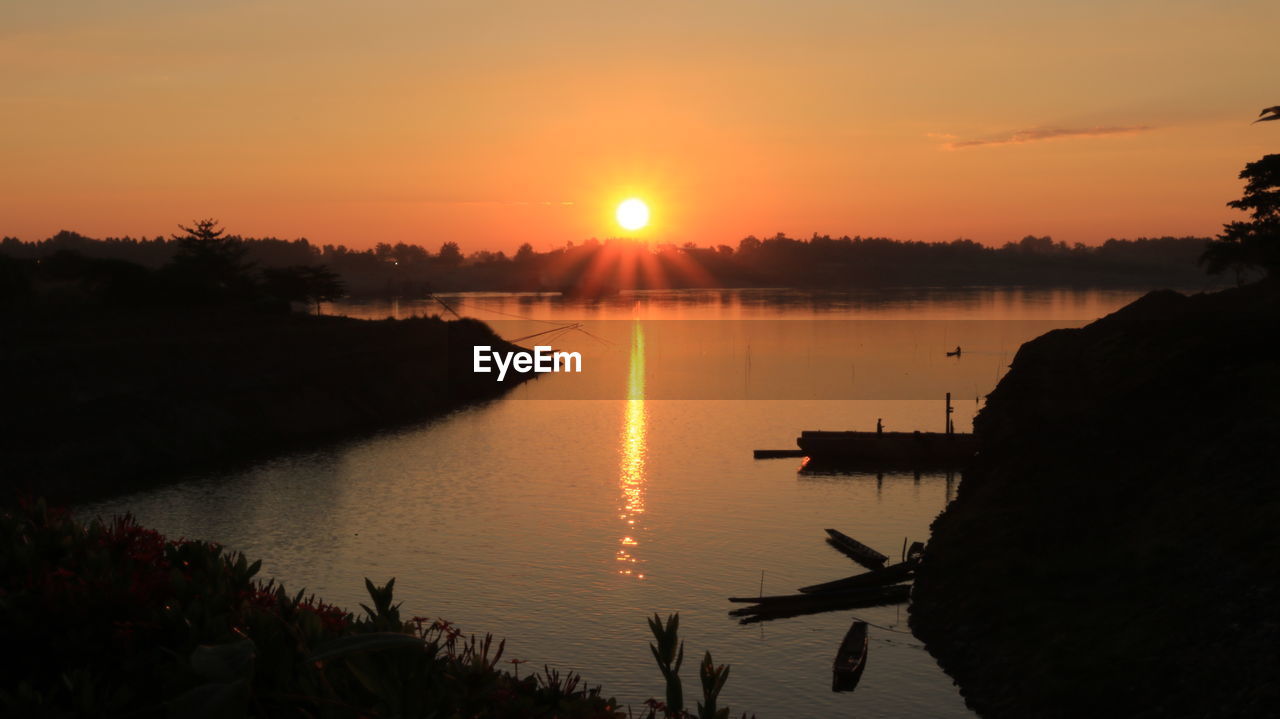 Scenic view of river during sunset