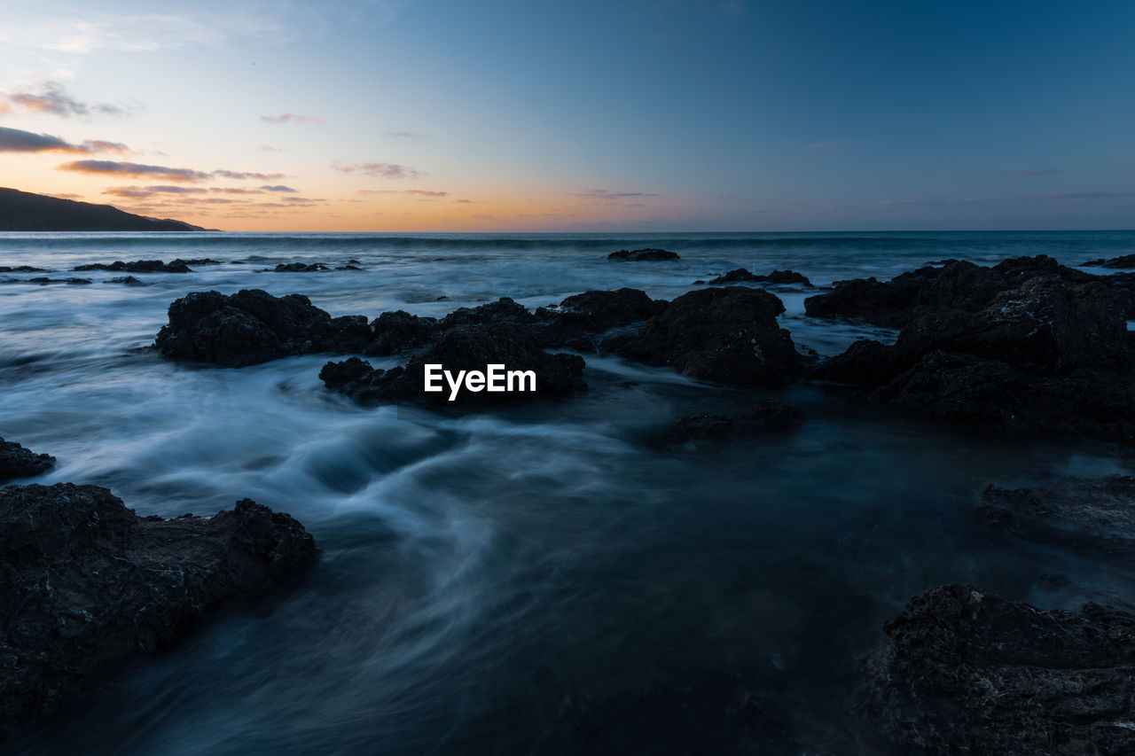 Scenic view of sea against sky during sunset