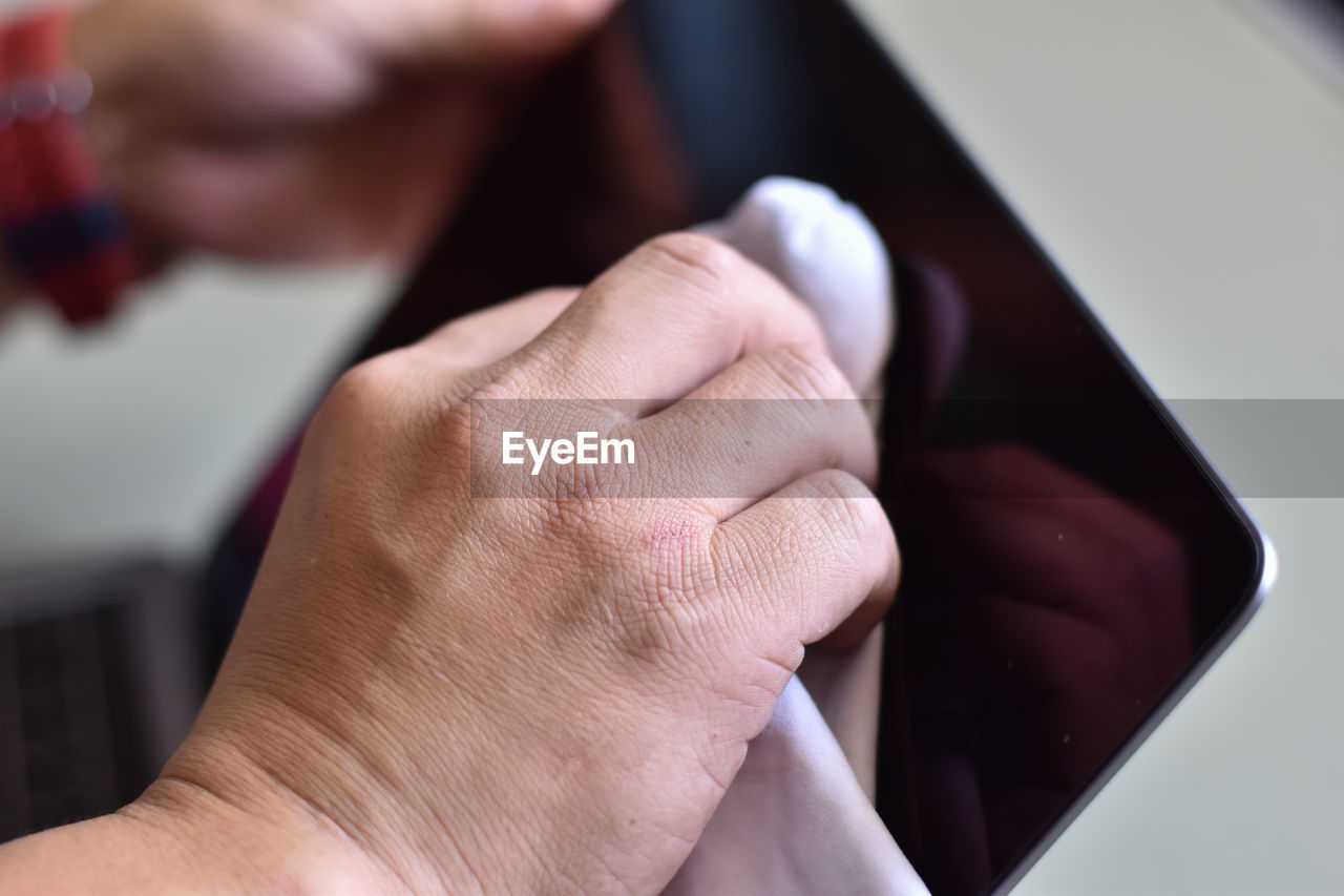 Close-up of hand holding hands