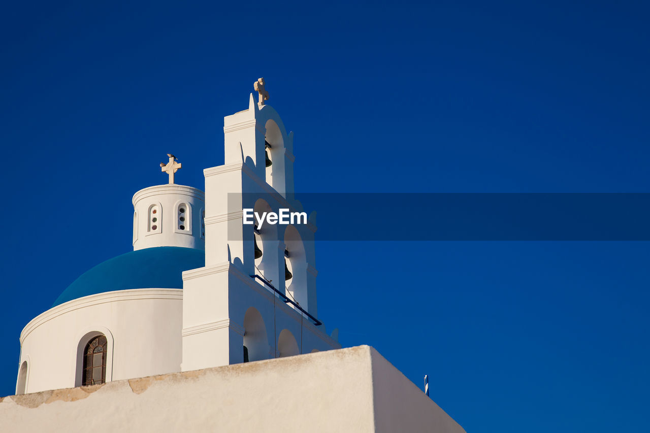 Dome and bell tower of the church of panagia platsani located in oia city at santorini island