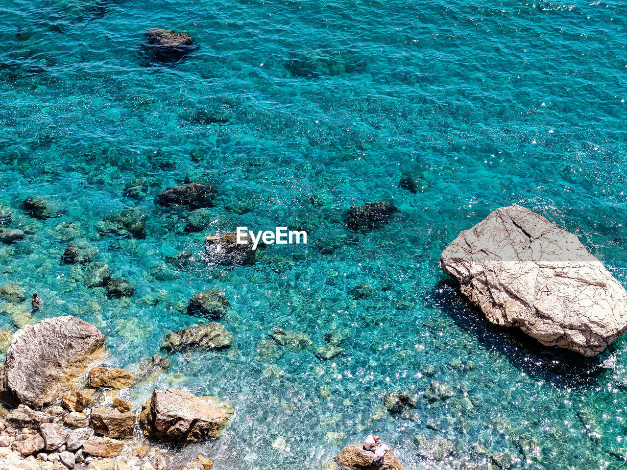 High angle view of rock on sea shore