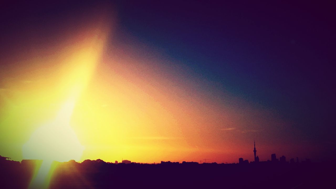 Silhouette landscape against romantic sky