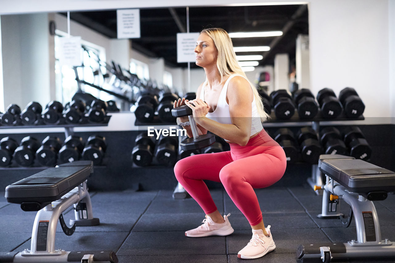 A female training at the gym.